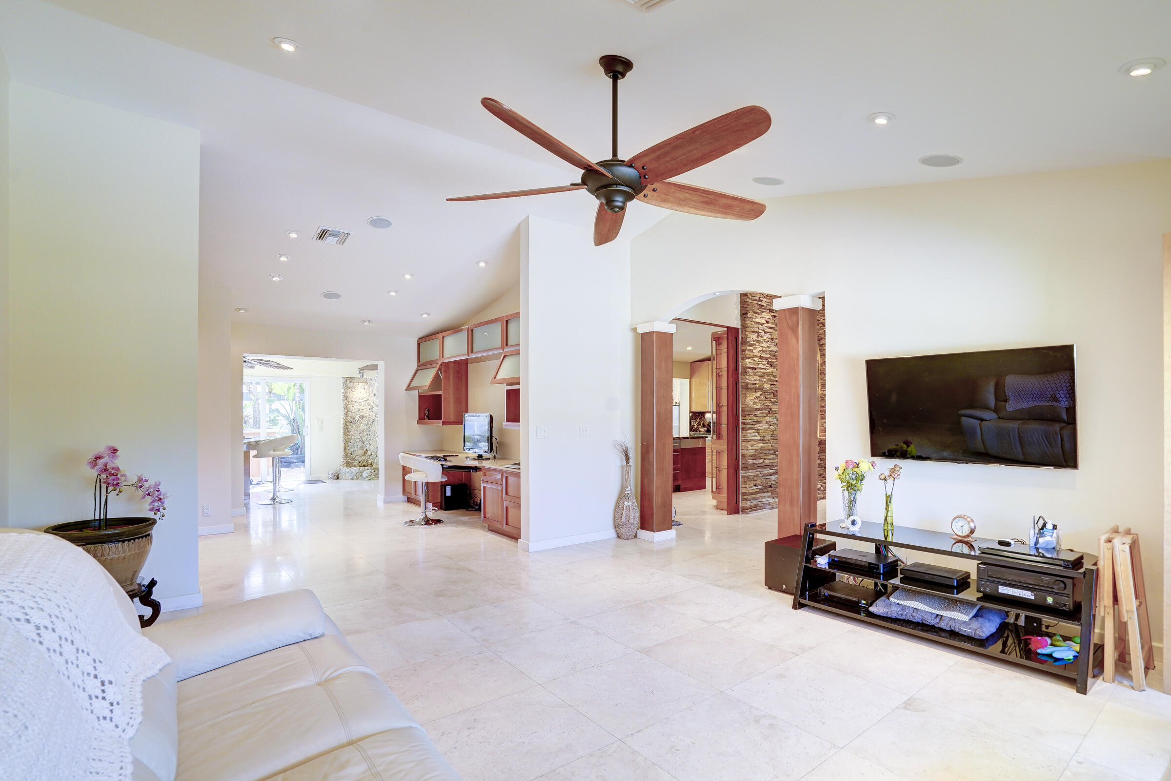 1191 Emerald Drive Singer Island, FL 33404 - Photo 9 of 60 a living room with furniture and a flat screen tv