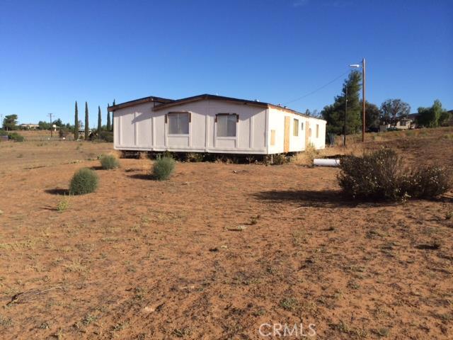 39638 San Ignacio Road Hemet, CA 92544 - Photo 1 of 1 a house with trees in the background
