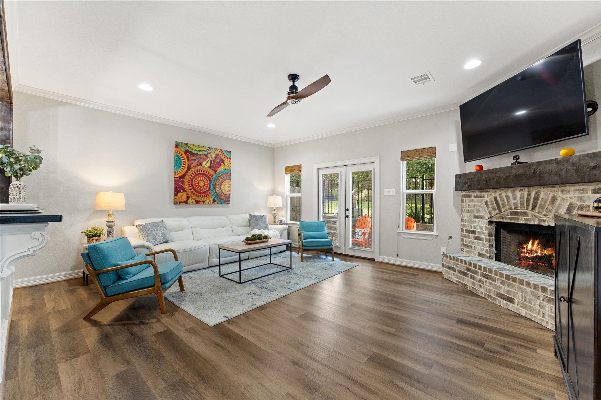 226 Capetown Conroe, TX 77356 - Photo 12 of 36 a living room with furniture and a fireplace