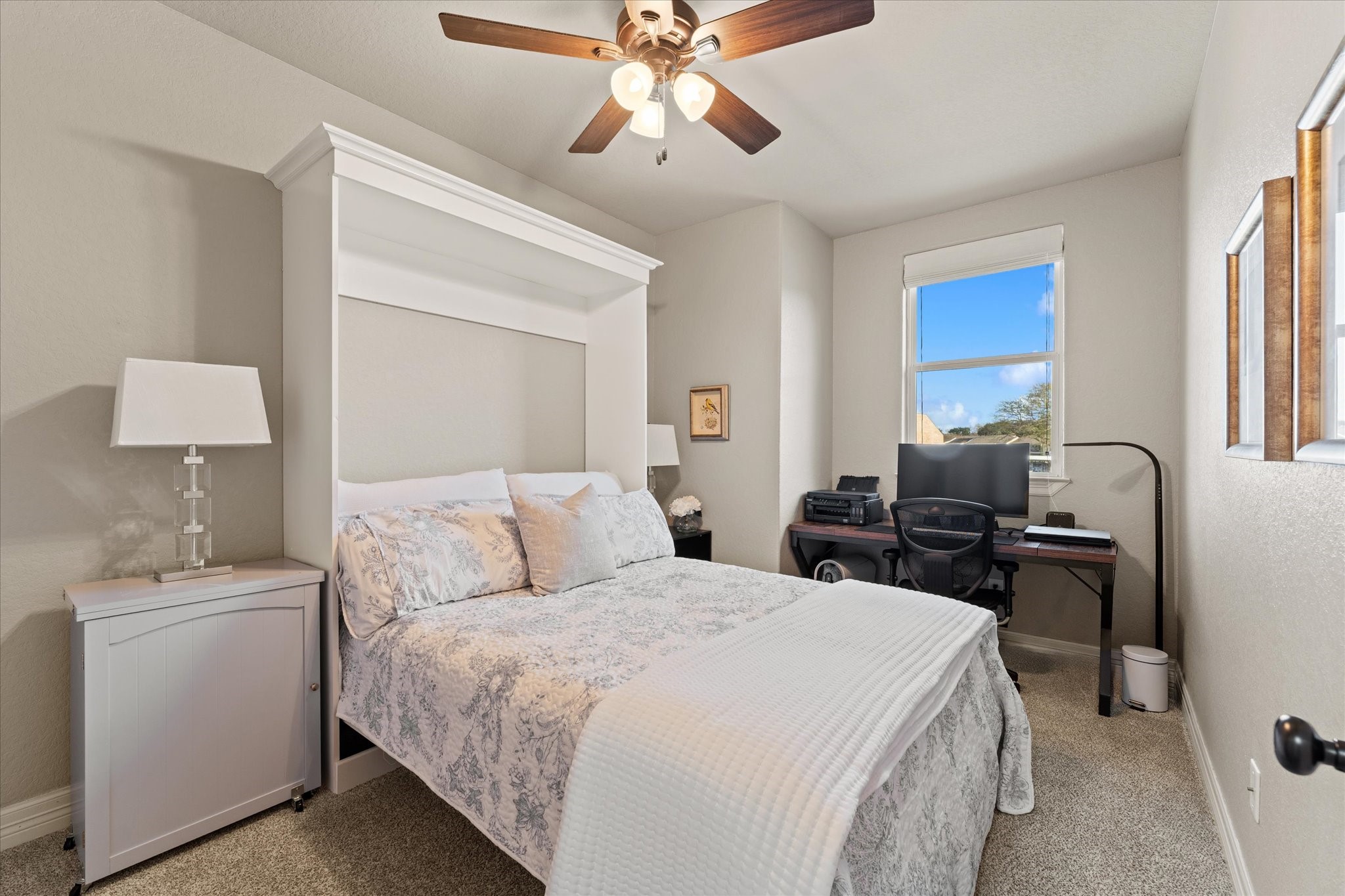 226 Capetown Conroe, TX 77356 - Photo 18 of 36 a bed room with a bed and a chandelier