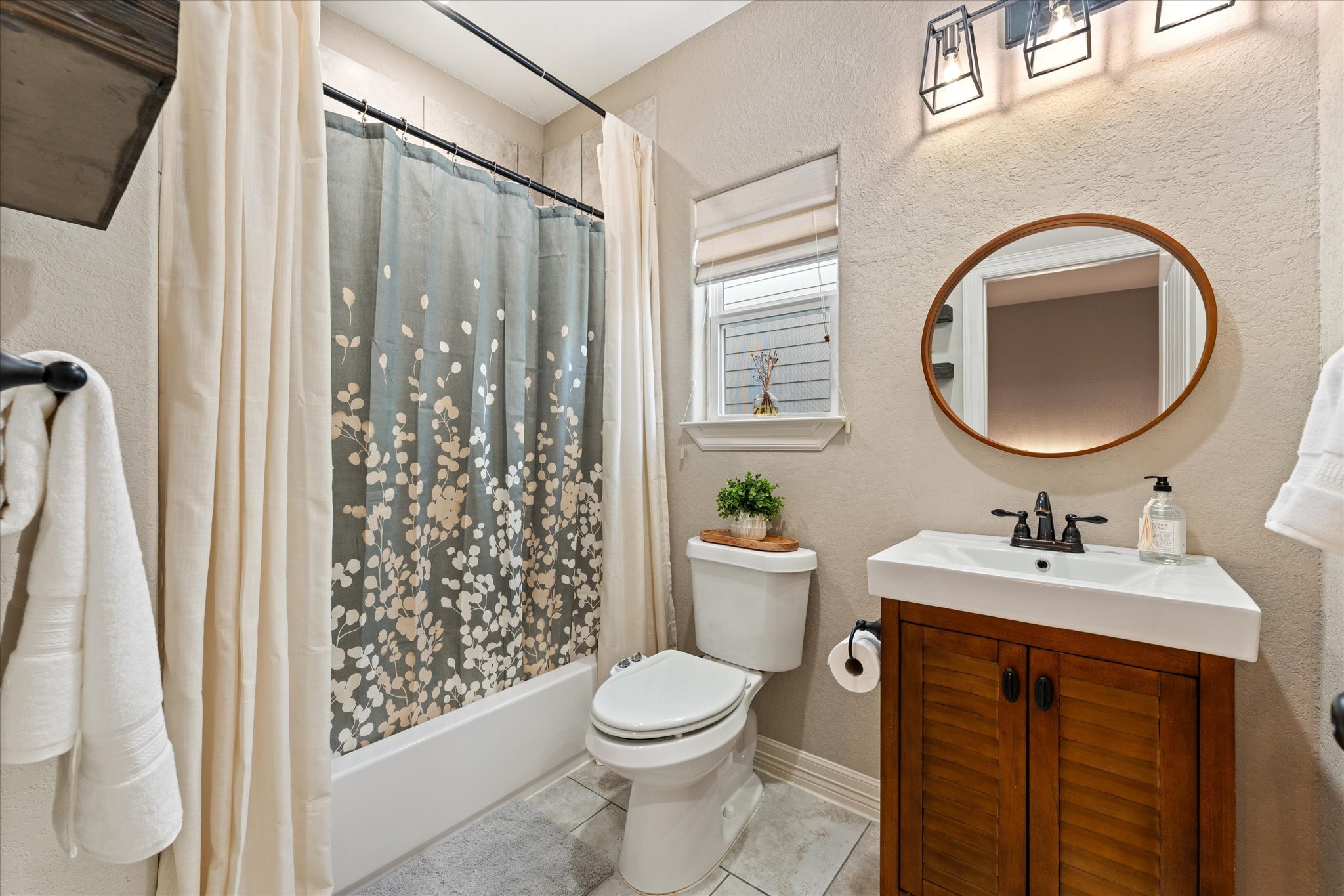 226 Capetown Conroe, TX 77356 - Photo 20 of 36 a bathroom with a toilet sink and mirror