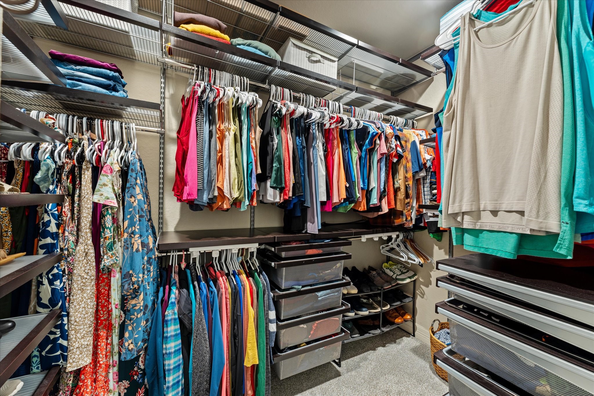 226 Capetown Conroe, TX 77356 - Photo 22 of 36 a view of walk in closet with clothes and shoes