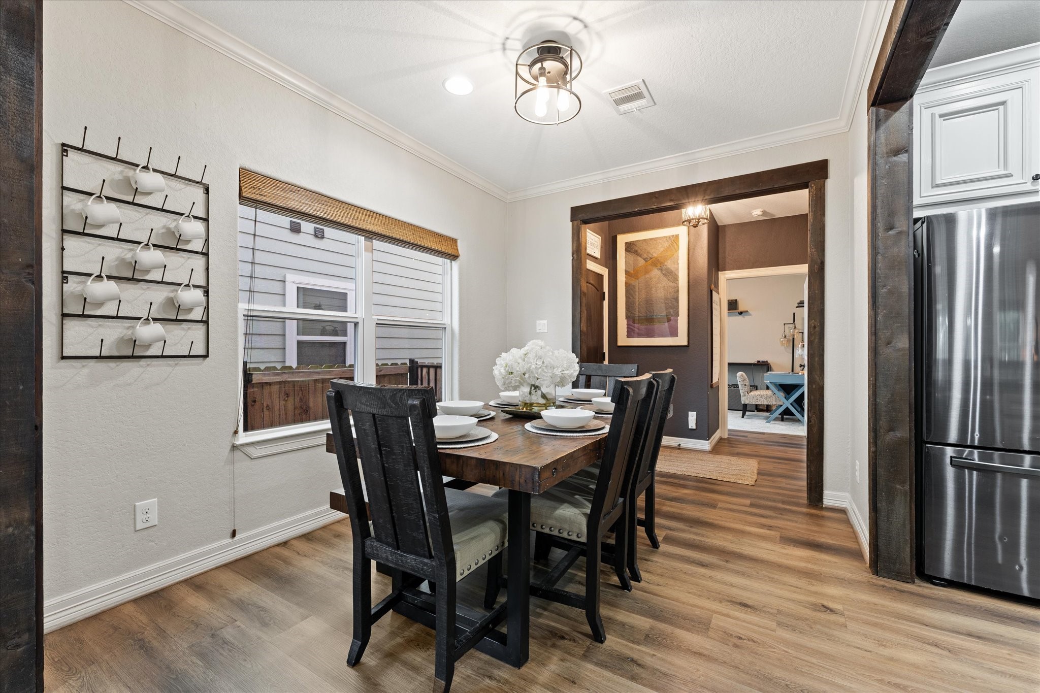 226 Capetown Conroe, TX 77356 - Photo 7 of 36 a view of a dining room with furniture window and wooden floor