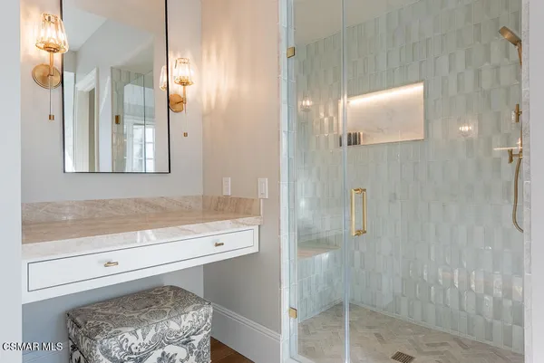 a bathroom with a shower and a sink