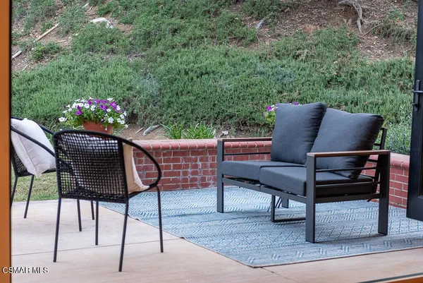 a outdoor living space with furniture and wooden floor