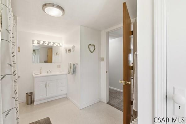66 Gdula Street Windber, PA 15963 - Photo 16 of 23 a spacious bathroom with a mirror and a sink