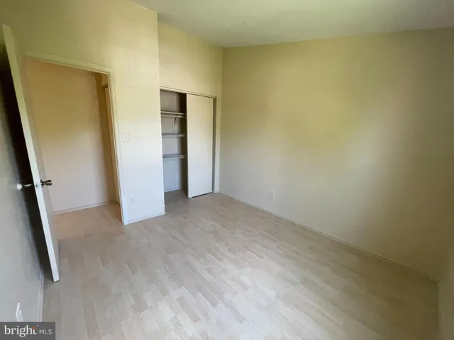 an empty room with an entrance to other room