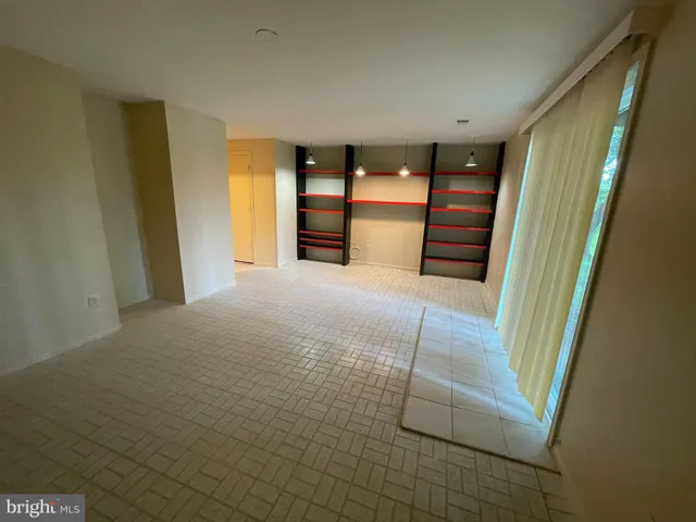 a view of a room with a large window