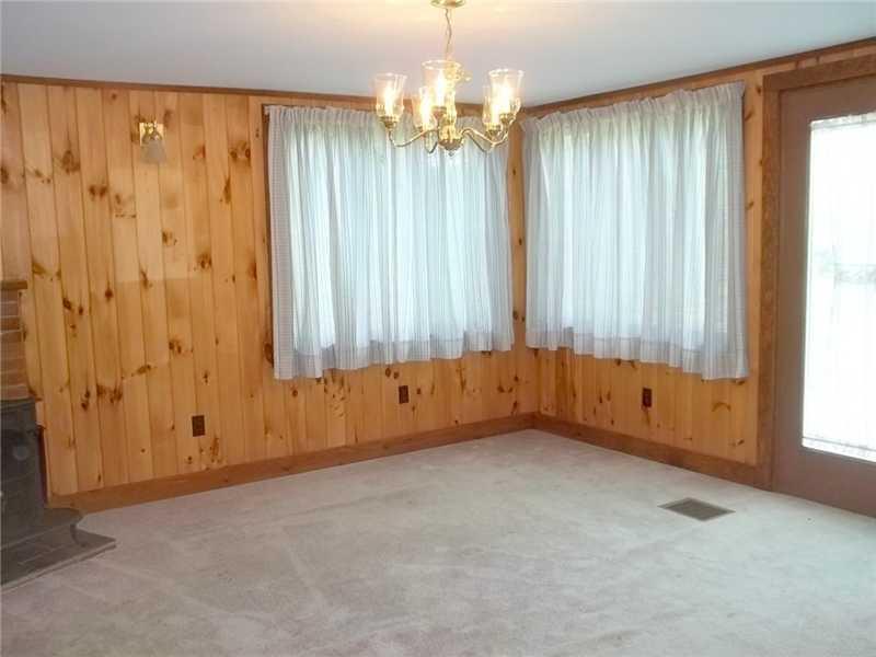 83 Heath Road Kennebunk, ME 04043 - Photo 7 of 14 Den. Den with Wood Stove