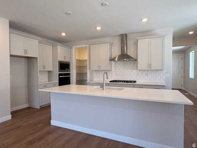 539 East Rimrock Lane Heber City, UT 84032 - Photo 3 of 13 Modern kitchen featuring a large central island with a solid surface countertop