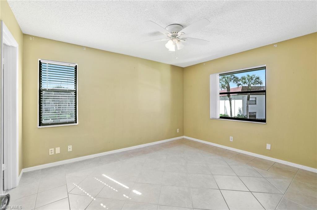 4345 27th Court Southwest, Unit 204 Naples, FL 34116 - Photo 13 of 25 a view of an empty room with a window