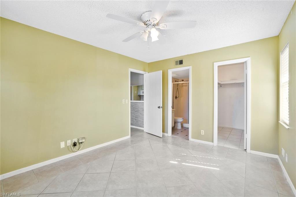 4345 27th Court Southwest, Unit 204 Naples, FL 34116 - Photo 14 of 25 a view of an empty room with a window