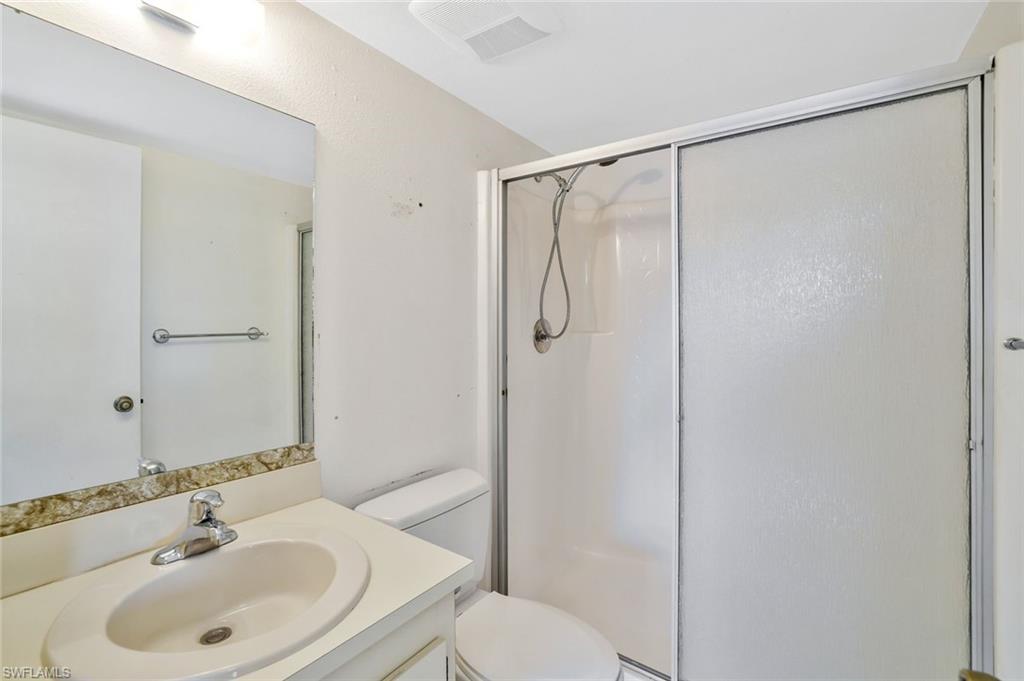 4345 27th Court Southwest, Unit 204 Naples, FL 34116 - Photo 15 of 25 a bathroom with a sink toilet and shower