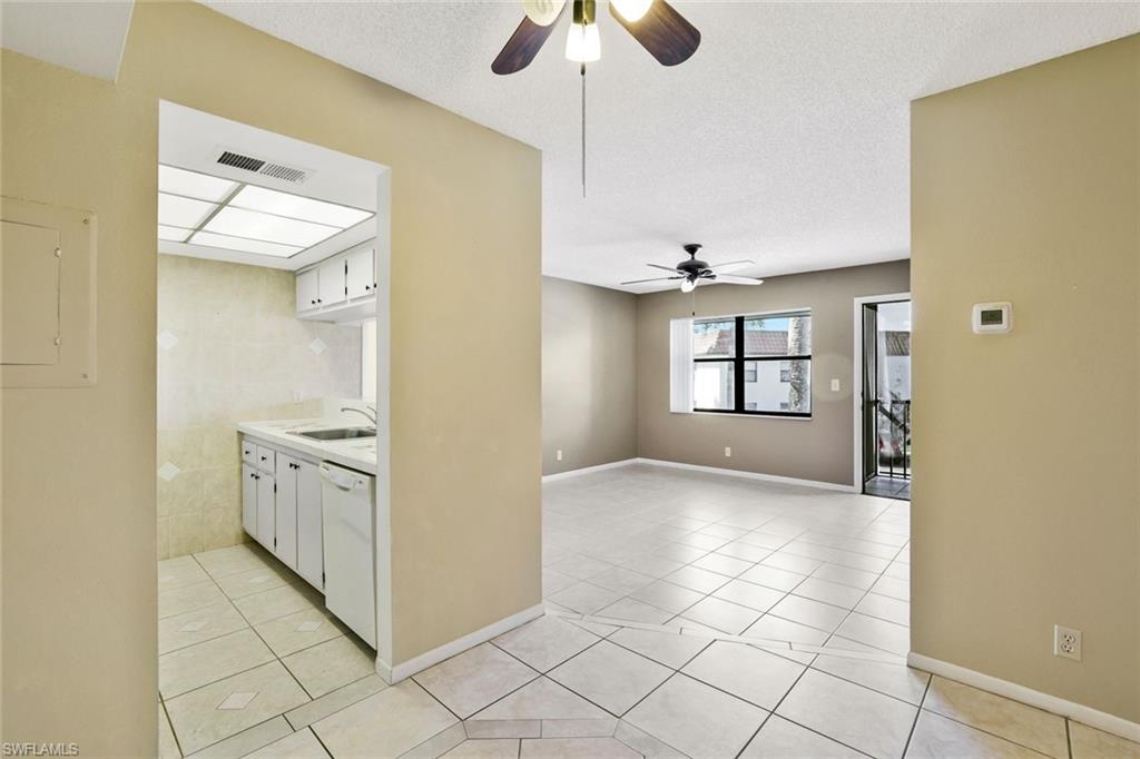 4345 27th Court Southwest, Unit 204 Naples, FL 34116 - Photo 8 of 25 a view of a kitchen with electric appliances