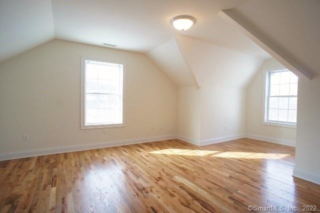 15 Arch Street, Unit B8 Norwalk, CT 06850 - Photo 5 of 10 an empty room with wooden floor and windows