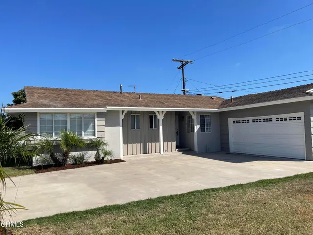 a front view of a house with a garage