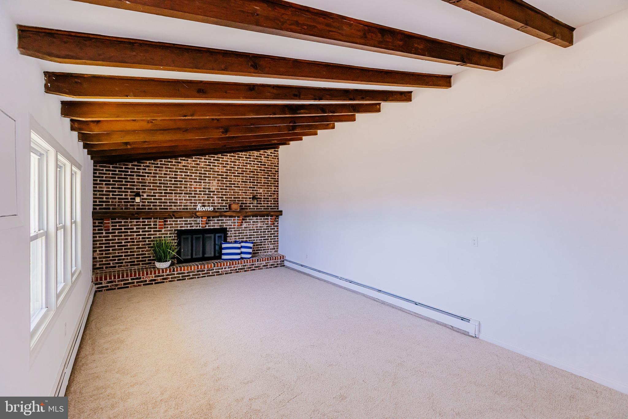 21 Velvet Lane Levittown, PA 19054 - Photo 11 of 47 a view of an empty room with a fireplace
