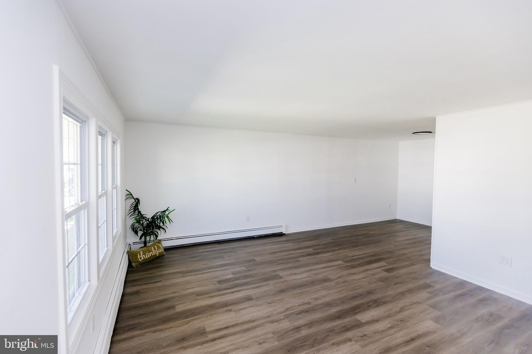 21 Velvet Lane Levittown, PA 19054 - Photo 17 of 47 a view of an empty room and wooden floor