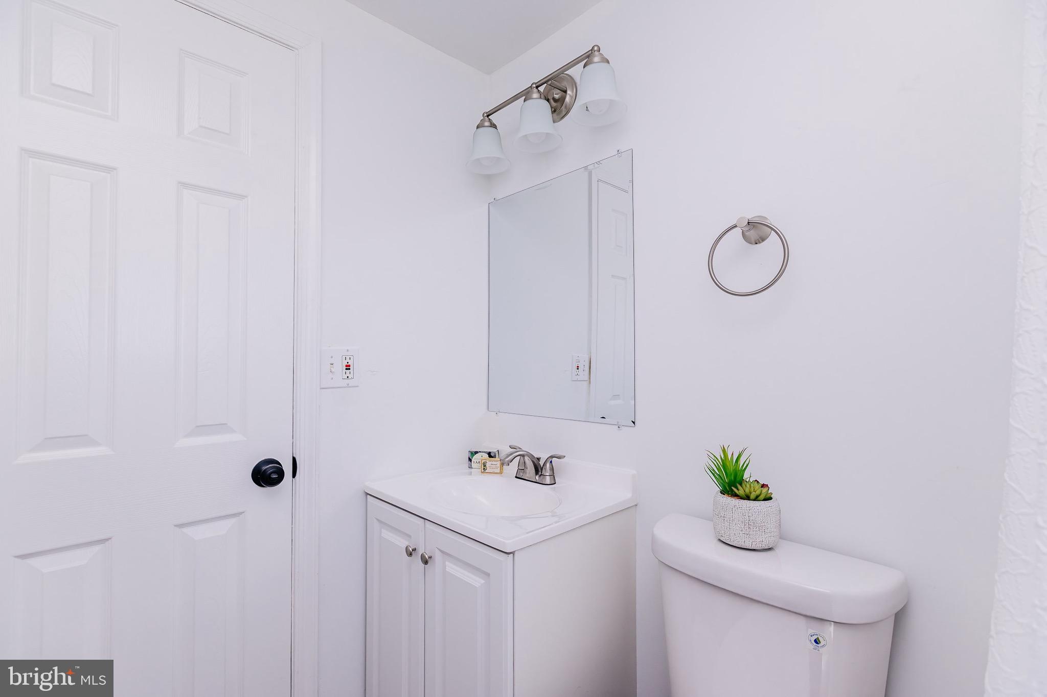 21 Velvet Lane Levittown, PA 19054 - Photo 31 of 47 a bathroom with a granite countertop sink a toilet and shower