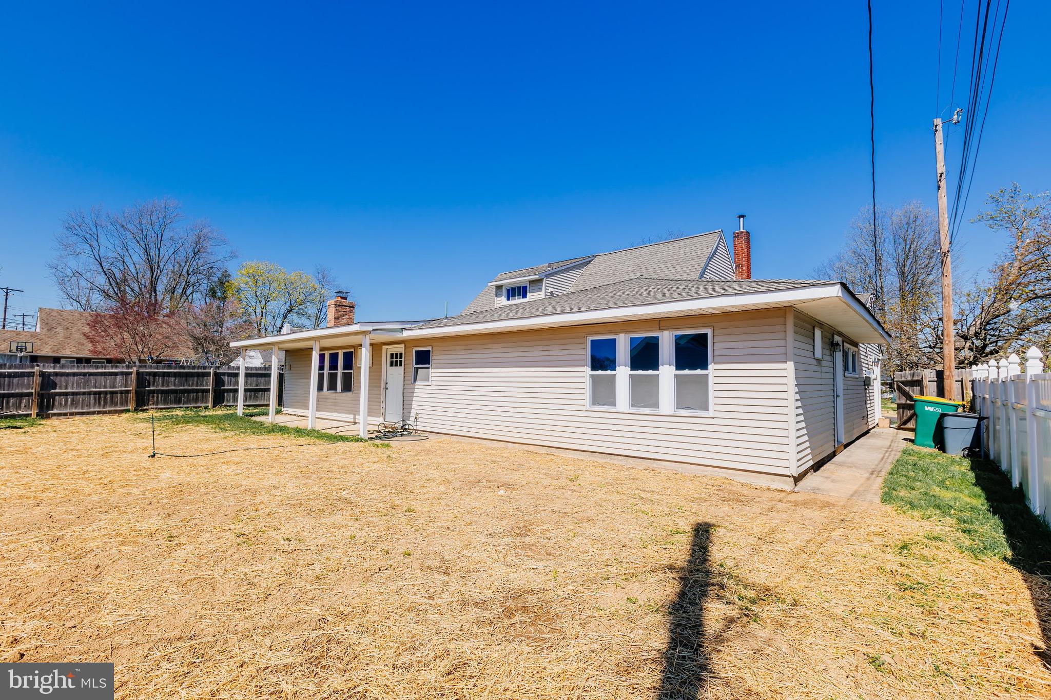 21 Velvet Lane Levittown, PA 19054 - Photo 41 of 47 a front view of house with yard and trees in the background