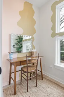 a view of a workspace with furniture