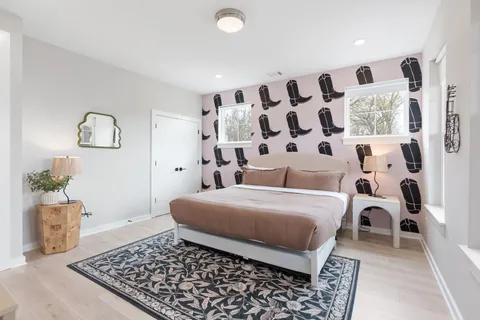 a bedroom with a bed and a table