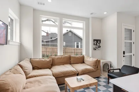 a living room with furniture and a large window