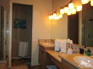 49549 Lewis Road Indio, CA 92201 - Photo 11 of 17 a bathroom with a sink vanity and a mirror
