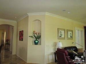 49549 Lewis Road Indio, CA 92201 - Photo 5 of 17 a living room with furniture and a potted plant