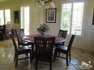 49549 Lewis Road Indio, CA 92201 - Photo 8 of 17 a view of a dining room with furniture and window