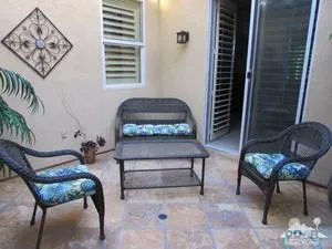 a bedroom with furniture and a chair