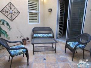 49549 Lewis Road Indio, CA 92201 - Photo 10 of 17 a bedroom with furniture and a chair