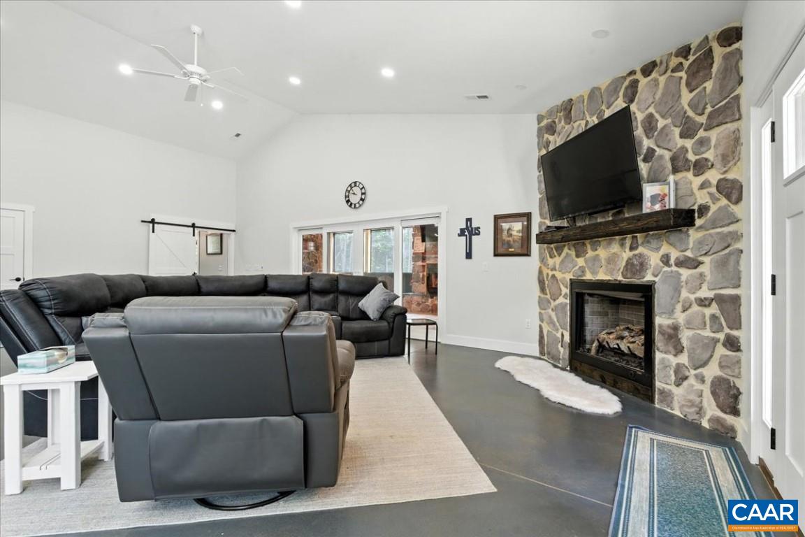 1568 Bent Creek Road Concord, VA 24538 - Photo 16 of 75 a living room with furniture a flat screen tv and a fireplace
