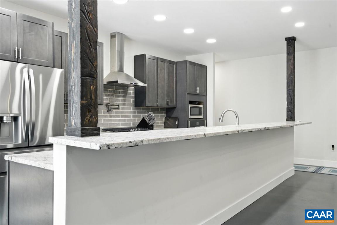 1568 Bent Creek Road Concord, VA 24538 - Photo 20 of 75 a kitchen with stainless steel appliances a sink and a refrigerator