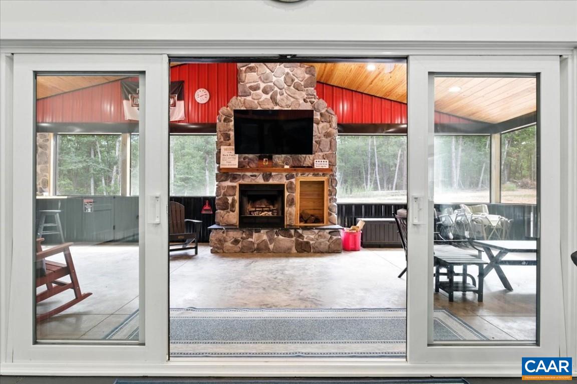 1568 Bent Creek Road Concord, VA 24538 - Photo 39 of 75 a living room with fireplace furniture and a flat screen tv