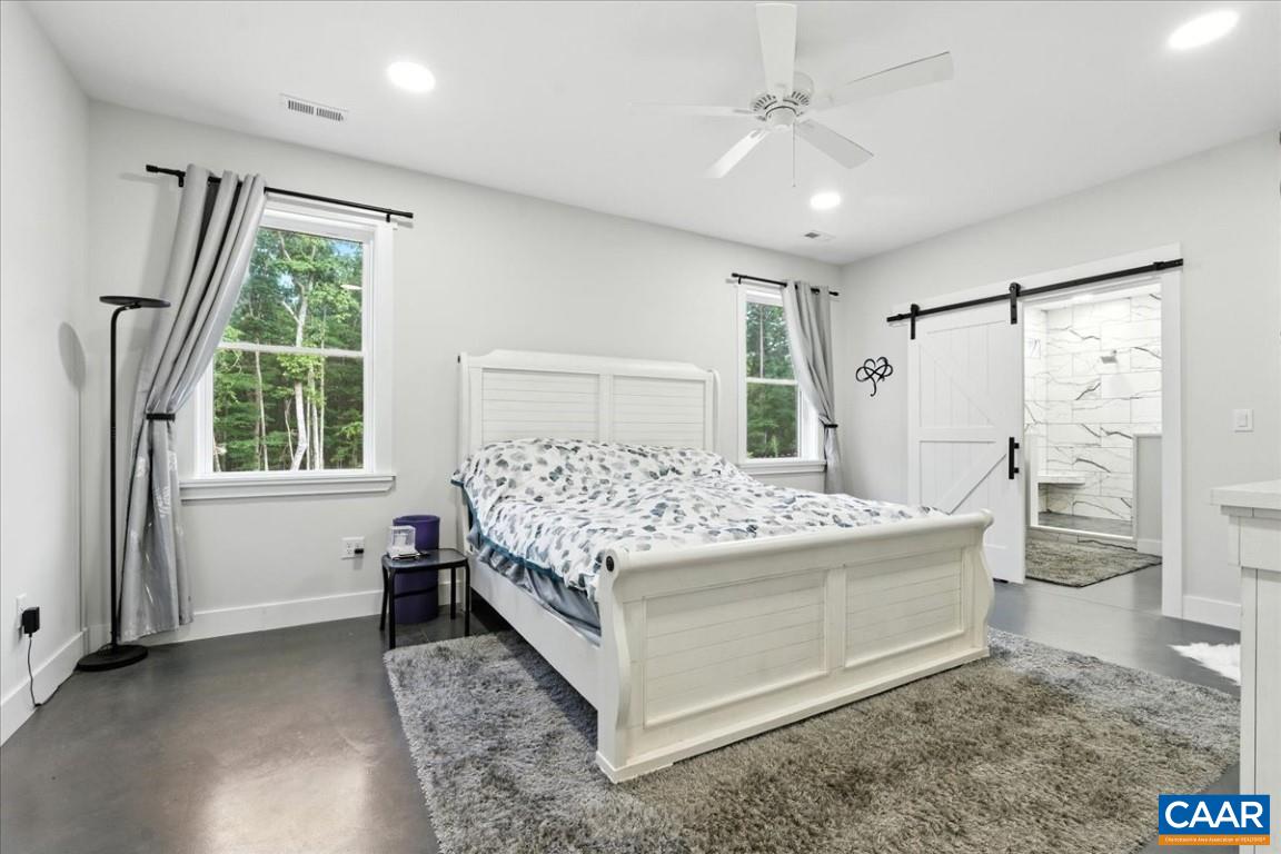 1568 Bent Creek Road Concord, VA 24538 - Photo 40 of 75 a bed sitting in a room next to a window