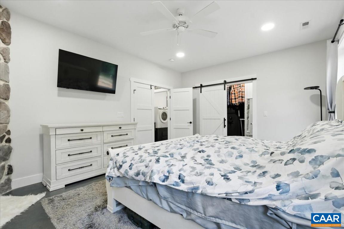 1568 Bent Creek Road Concord, VA 24538 - Photo 42 of 75 a bedroom with a bed and a flat screen tv