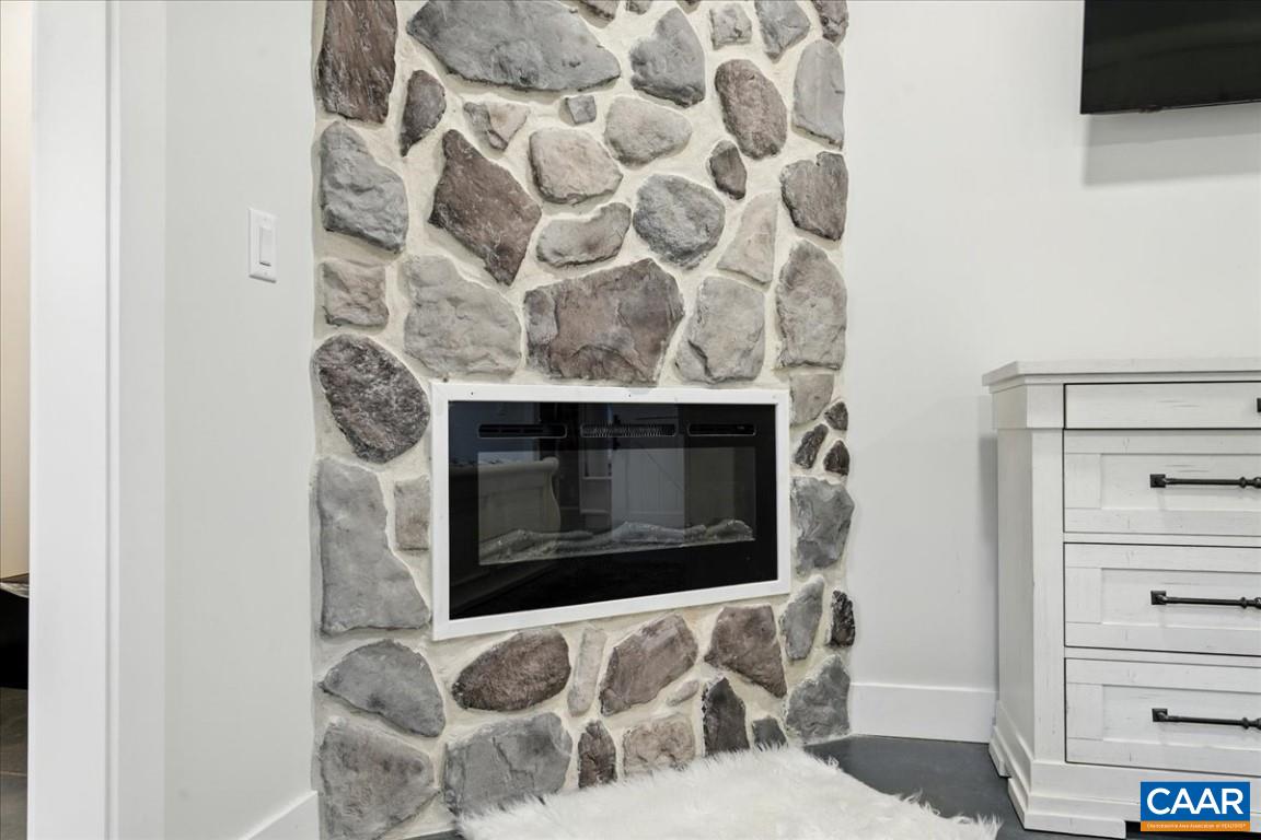 1568 Bent Creek Road Concord, VA 24538 - Photo 43 of 75 a living room with furniture and a fireplace