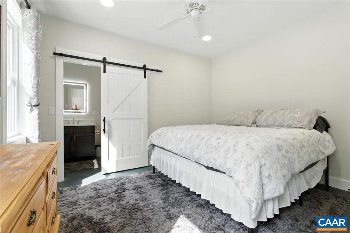 1568 Bent Creek Road Concord, VA 24538 - Photo 53 of 75 a spacious bedroom with a bed and a fireplace