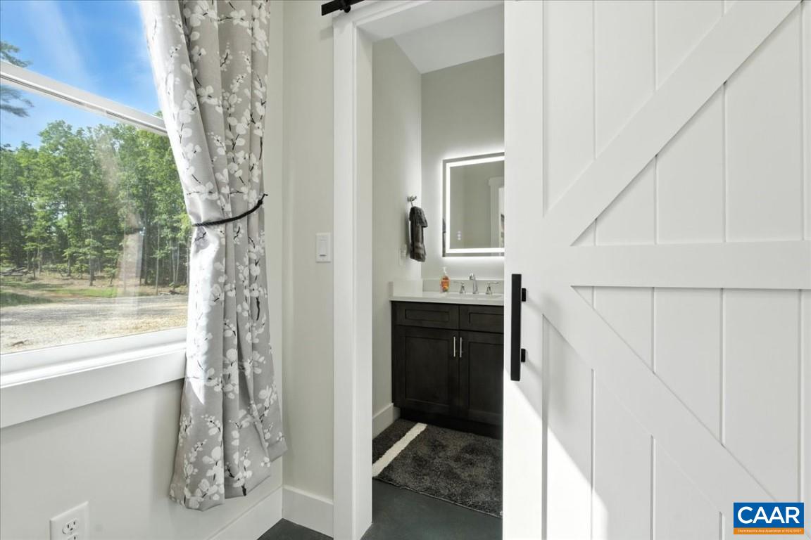 1568 Bent Creek Road Concord, VA 24538 - Photo 56 of 75 a bathroom with a sink and a mirror