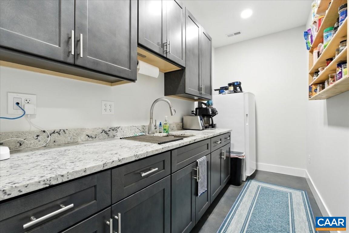 1568 Bent Creek Road Concord, VA 24538 - Photo 59 of 75 a bathroom with a double vanity sink and a mirror
