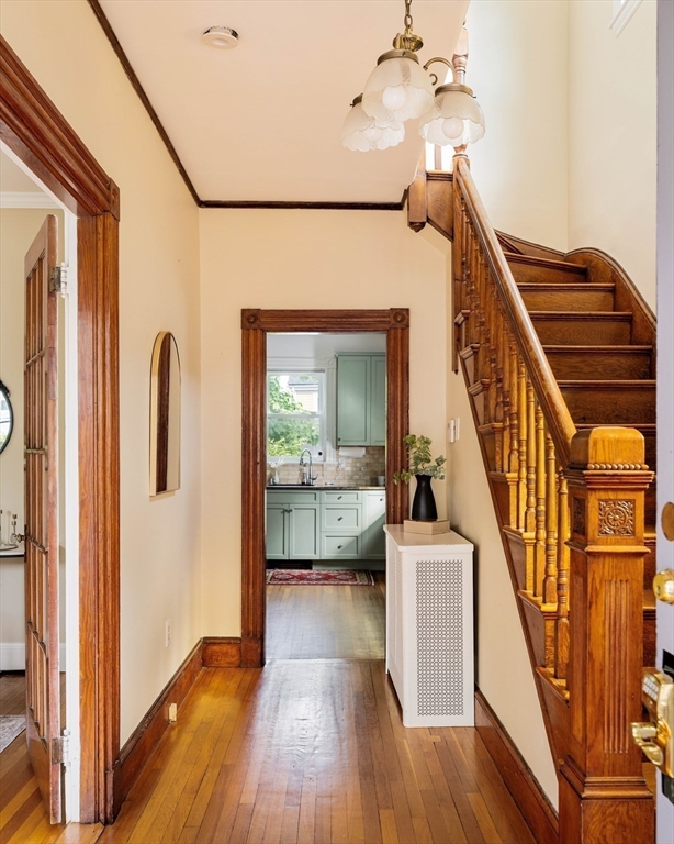 52 Walter Street Boston, MA 02131 - Photo 15 of 31 a view of a hallway with wooden floor and staircase
