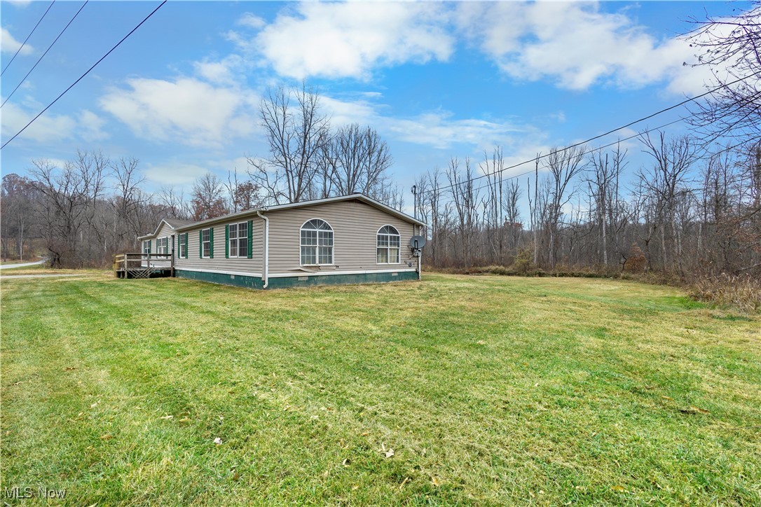 View of home's exterior featuring a yard
