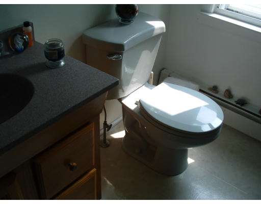 74 Bither Street Springfield, MA 01118 - Photo 19 of 22 a bathroom with a sink and mirror