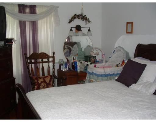 74 Bither Street Springfield, MA 01118 - Photo 7 of 22 a bed room with two bed and a chair