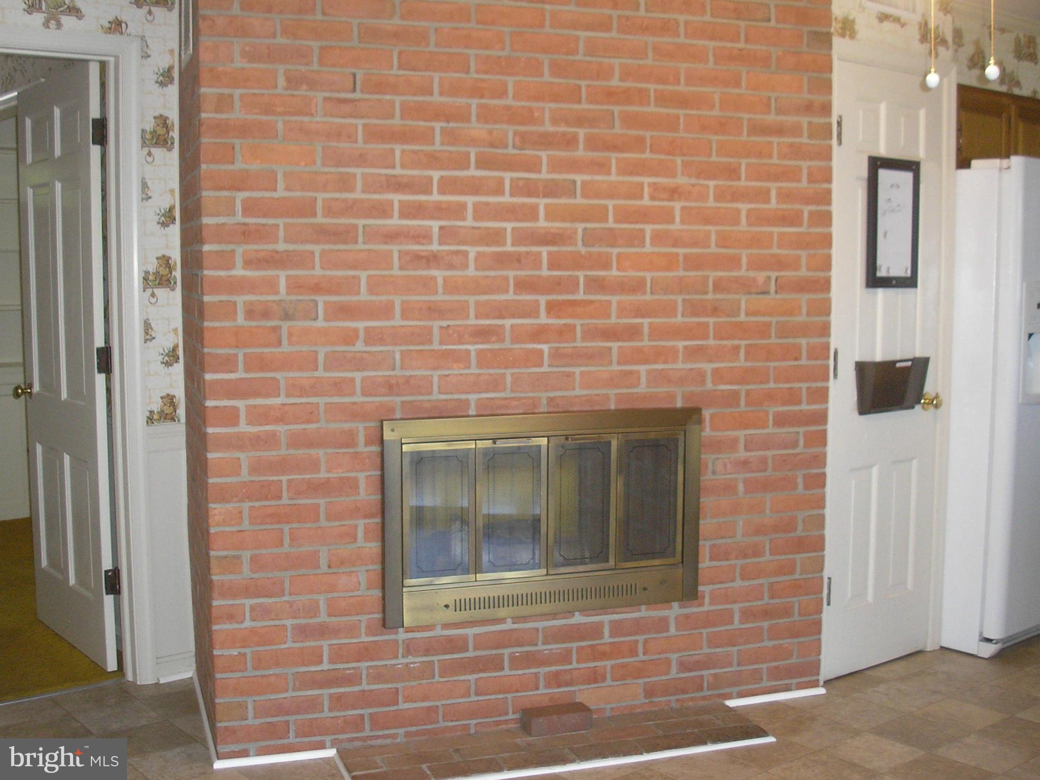 557 Fey Road Chestertown, MD 21620 - Photo 11 of 16 Kitchen Two Sided Fireplace