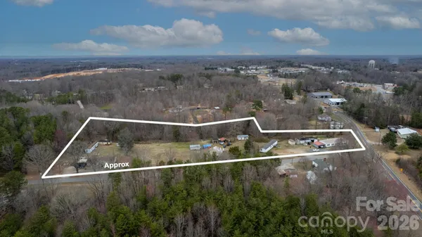 an aerial view of house with yard