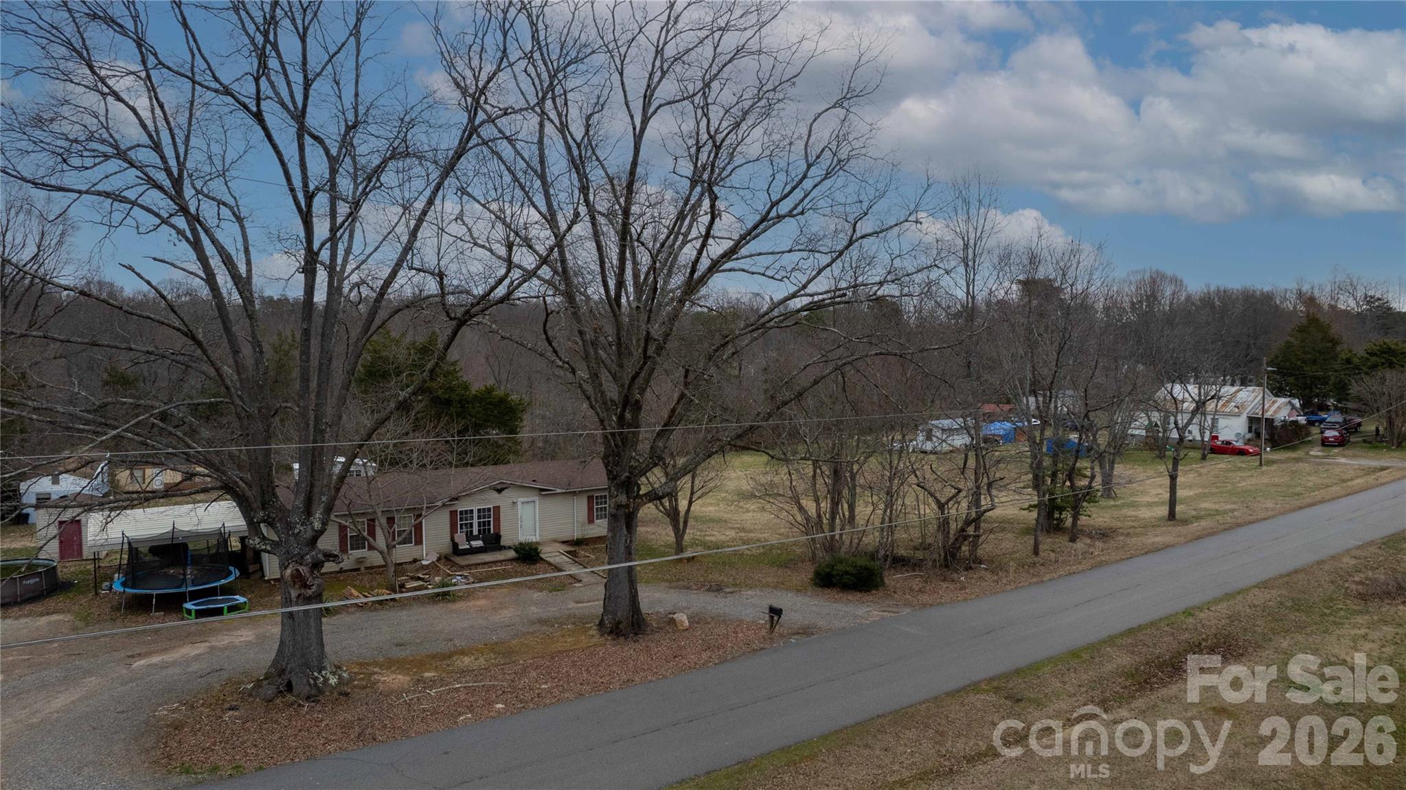 116 Lipe Road Troutman, NC 28166 - Photo 11 of 11 a street view with residential house