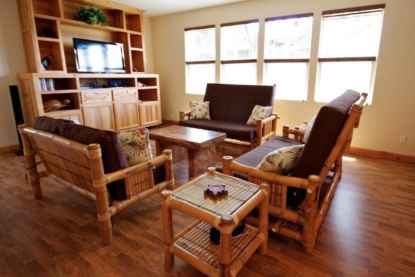 2270 Pane Road, Unit 1 Koloa, HI 96756 - Photo 3 of 6 a living room with furniture a flat screen tv and a table