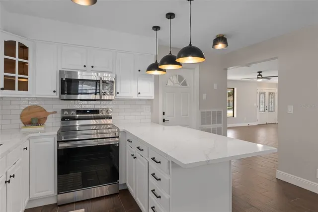 a kitchen with a stove and a sink